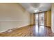 Large bedroom with hardwood floors and access to balcony at 1286 River Oaks Dr. # 8-M, Myrtle Beach, SC 29579