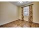 Well-lit bedroom with wood flooring and floral curtains at 1286 River Oaks Dr. # 8-M, Myrtle Beach, SC 29579