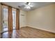Bright bedroom with wood-look floors and access to a private balcony at 1286 River Oaks Dr. # 8-M, Myrtle Beach, SC 29579