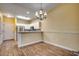 Bright dining room with hardwood floors and chandelier at 1286 River Oaks Dr. # 8-M, Myrtle Beach, SC 29579