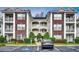 Brick building exterior with ample parking at 1286 River Oaks Dr. # 8-M, Myrtle Beach, SC 29579