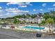 Inviting community pool with surrounding lounge chairs and building views at 1286 River Oaks Dr. # 8-M, Myrtle Beach, SC 29579