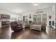 Comfortable living room featuring hardwood floors and a large TV at 144 Bucky Loop, Murrells Inlet, SC 29576