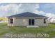 Rear exterior of a single-story home with a small patio and grassy backyard at 1504 Clubstone Dr., Conway, SC 29526