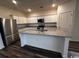 Modern kitchen featuring white shaker cabinets, stainless steel appliances, and granite countertops at 166 Linares St., Loris, SC 29569