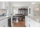 Dining area with hardwood floors, a china cabinet, and access to the kitchen at 1673 Middleton St., Georgetown, SC 29440