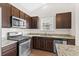 Updated kitchen featuring stainless steel appliances, granite countertops, and ample cabinet space at 1711 Sapphire Dr., Longs, SC 29568