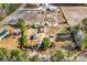 An aerial view of a property with a house, sheds, fenced yard, and open fields at 1744 Log Cabin Rd., Loris, SC 29569