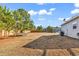 Fenced backyard with storage shed, trampoline, trees, and the house visible at 1744 Log Cabin Rd., Loris, SC 29569