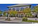 Exterior view of the community clubhouse with outdoor seating and lush landscaping at 2180 Waterview Dr. # 324, North Myrtle Beach, SC 29582