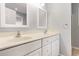 Double vanity bathroom with white cabinets, beige countertop, and two mirrors at 224 Black Bear Rd., Myrtle Beach, SC 29588