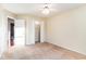 Empty bedroom with neutral walls, carpet, ceiling fan, and open door to closet at 224 Black Bear Rd., Myrtle Beach, SC 29588