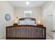 Cozy bedroom with a wooden bedframe and soft blue linens at 300 Carmello Circle, Conway, SC 29526