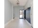 Inviting foyer with tiled floors, a coat rack, and an open staircase at 305 Rung Rd. # 5, Myrtle Beach, SC 29588