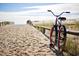 Bicycle parked on a sandy beach path at 3413 Cove Side Ct., North Myrtle Beach, SC 29582