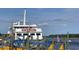 Casino boat docked at a pier with flags and pilings at 3413 Cove Side Ct., North Myrtle Beach, SC 29582