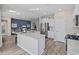 Modern kitchen featuring white cabinets, stainless steel appliances, granite countertops, and a peninsula with seating at 3413 Cove Side Ct., North Myrtle Beach, SC 29582
