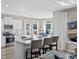 Well-appointed kitchen with white shaker cabinets, stainless steel appliances, and large windows at 3413 Cove Side Ct., North Myrtle Beach, SC 29582
