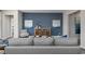 Cozy living room featuring a gray sofa, blue accent wall, and wooden furniture at 3413 Cove Side Ct., North Myrtle Beach, SC 29582