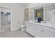 Elegant main bathroom with double vanity, white cabinets, and tiled floor at 3413 Cove Side Ct., North Myrtle Beach, SC 29582