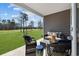 Covered patio with wicker furniture overlooking a golf course at 3413 Cove Side Ct., North Myrtle Beach, SC 29582
