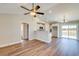 Living room with vaulted ceilings, wood-look floors, and access to the kitchen at 3421 B And S Rd., Loris, SC 29569