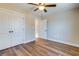 Bedroom with open closet doors and an open door to another room at 3427 B And S Rd., Loris, SC 29569