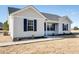 Charming single-story home with gray siding, dark shutters, and a covered front porch at 3427 B And S Rd., Loris, SC 29569