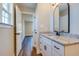 White bathroom vanity with granite countertop and black fixtures at 3439 B And S Rd., Loris, SC 29569