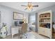 Home office or den with white desk, chair, and built-in shelving at 4577 Fringetree Dr., Murrells Inlet, SC 29576