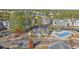 Aerial view of the community pool, clubhouse, and surrounding buildings at 4924 Pond Shoals Ct. # 101, Myrtle Beach, SC 29579
