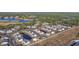 Aerial view of the community with buildings, parking, and a pond at 4924 Pond Shoals Ct. # 101, Myrtle Beach, SC 29579