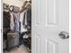 Walk-in closet filled with clothes, shoes, luggage, and storage bins at 4924 Pond Shoals Ct. # 101, Myrtle Beach, SC 29579