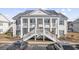 Attractive two-story condo building with balconies and front steps at 4924 Pond Shoals Ct. # 101, Myrtle Beach, SC 29579