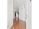 Hallway with wood-look flooring and white doors at 4924 Pond Shoals Ct. # 101, Myrtle Beach, SC 29579