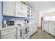 White kitchen with light countertops, a stove, microwave, and coffee maker at 4924 Pond Shoals Ct. # 101, Myrtle Beach, SC 29579