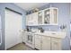 Kitchen with white cabinets, light countertops, and a door at 4924 Pond Shoals Ct. # 101, Myrtle Beach, SC 29579