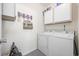 Laundry room with white washer, dryer, and storage cabinets at 4924 Pond Shoals Ct. # 101, Myrtle Beach, SC 29579
