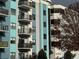 View of a teal and grey condo building exterior with balconies at 5001 Little River Rd. # W109, Myrtle Beach, SC 29577