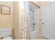 Clean bathroom with shower/tub combo, toilet, and floral shower curtain at 5080 Forest Dr., Loris, SC 29569