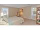 Cozy bedroom with carpeted floors, a bed, a wooden shelf, and two large windows at 5080 Forest Dr., Loris, SC 29569
