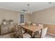 Dining room with a wooden table, chandelier, and charming rustic decor at 5080 Forest Dr., Loris, SC 29569