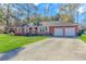 Charming red brick home with two-car garage and landscaped front yard at 5080 Forest Dr., Loris, SC 29569