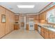 Kitchen with ample counter space, wood cabinets, and white appliances at 5080 Forest Dr., Loris, SC 29569