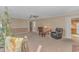 Living room with a fireplace, comfortable seating, and view of the adjacent kitchen at 5080 Forest Dr., Loris, SC 29569