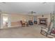 Cozy living room with fireplace, rocking chairs, and access to the dining area at 5080 Forest Dr., Loris, SC 29569