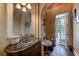 Elegant half-bath with granite countertop and access to the pool area at 604 Stableford Ct., Myrtle Beach, SC 29577