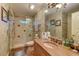 Spacious bathroom featuring tiled shower, vanity with sink, and toilet at 604 Stableford Ct., Myrtle Beach, SC 29577