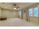 Bedroom with large windows, ceiling fan, and plush carpeting at 604 Stableford Ct., Myrtle Beach, SC 29577