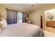 Bedroom with a large bed, ceiling fan, closet and attached bathroom at 604 Stableford Ct., Myrtle Beach, SC 29577